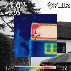 Thermal image of a roof with the red showing the heat loss